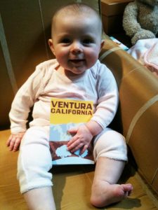 04-20-2012. My little niece, Ellie, showing off a cool Ventura postcard. She's huge now!