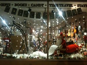 11-27-2012. Our first Christmas window display. We have fun with our giant vintage Santa. My mom is usually the genius behind these displays.